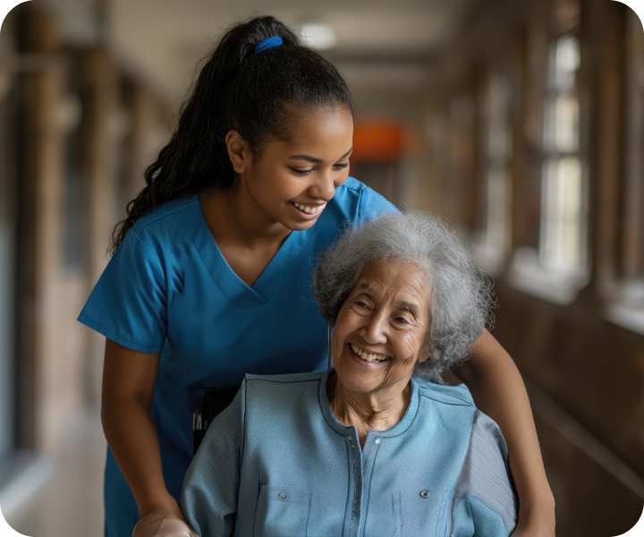 Caregiver assisting a happy patient to her next destination